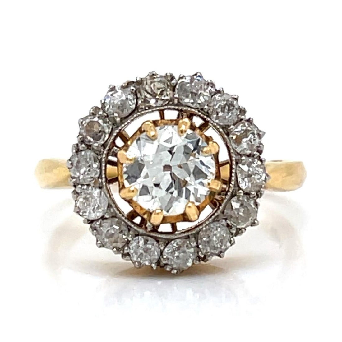 18K Yellow Gold Victorian Ring with Diamonds and Old Mine Stones: 18K Yellow Gold Victorian Ring with Diamonds and Old Mine Stones This Victorian ring is crafted from 18K yellow gold and weighs 5.9 grams. The centerpiece features an approximately 0.75 carat diamond 