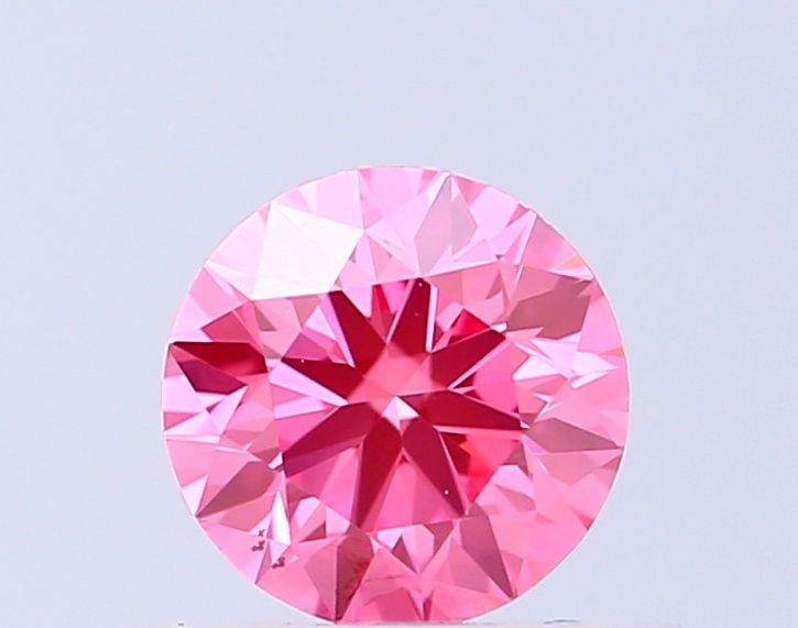 Loose Diamond - ROUND 0.53ct Fancy Vivid Pink VS2: Loose Diamond - ROUND 0.53ct Fancy Vivid Pink VS2 Source: This is a real non-mined Diamond that has been grown in a lab Shape: ROUND Carats: 0.53 Color: Fancy Vivid Pink Certification: IGI Video: