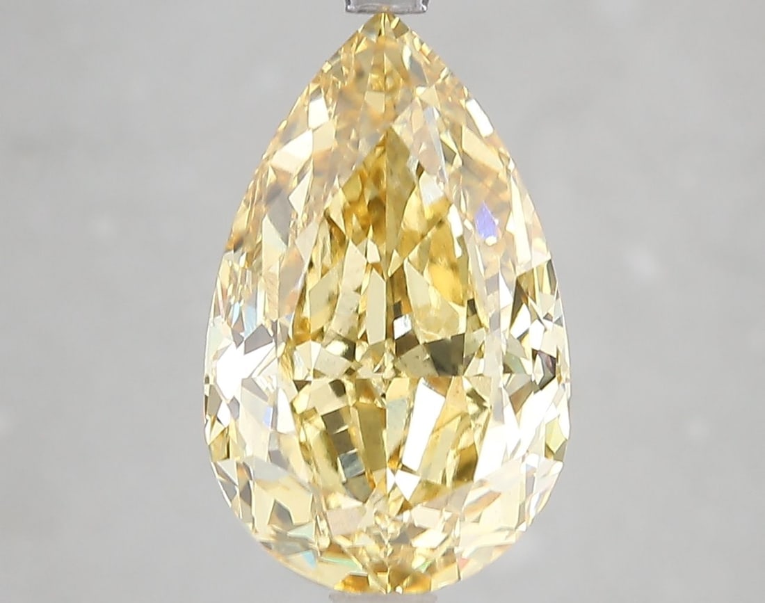 Loose Diamond - PEAR 5.45ct Fancy Vivid Yellow VS2: Loose Diamond - PEAR 5.45ct Fancy Vivid Yellow VS2 Source: This is a real non-mined Diamond that has been grown in a lab Shape: PEAR Carats: 5.45 Color: Fancy Vivid Yellow Certification: IGI Video:
