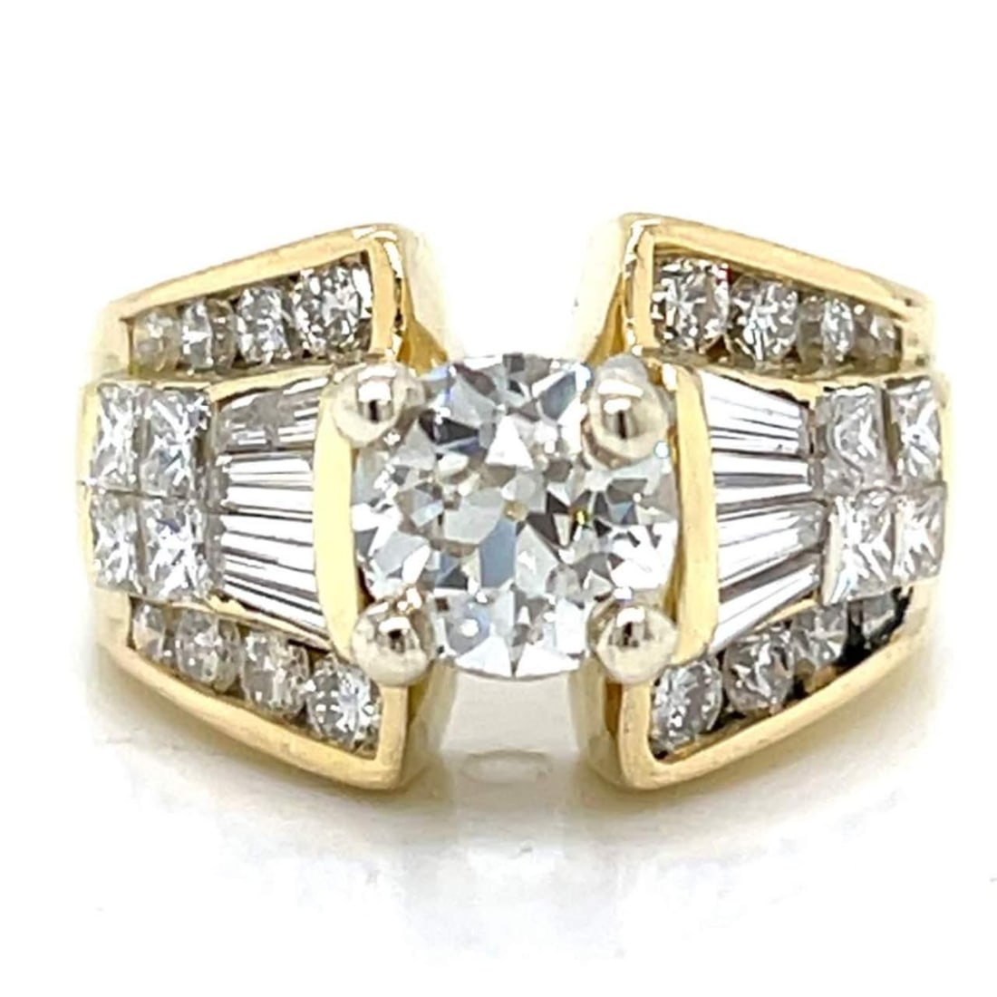Elegant 18K Yellow Gold 3.50 Ct. Diamond Ring with European-Cut Center: Elegant 18K Yellow Gold 3.50 Ct. Diamond Ring with European-Cut Center This stunning 18K Yellow Gold ring showcases a captivating 3.50 Ct. total diamond weight, featuring a center European-cut diamond