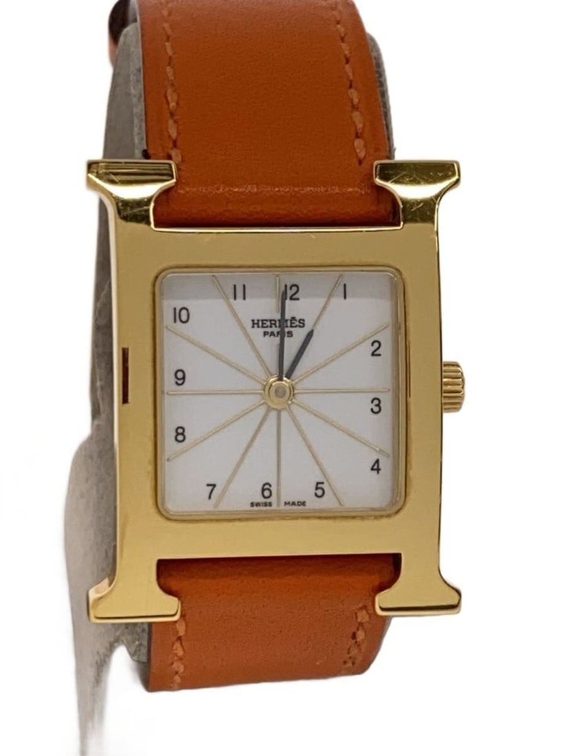Hermes H Watch PM Quartz White Leather Women's Wristwatch: Hermes H Watch PM Quartz White Leather Women's Wristwatch This Hermes H-Watch PM Quartz HH1.210 is a women's wristwatch featuring a white dial and a leather band. The watch is slightly used, showing s