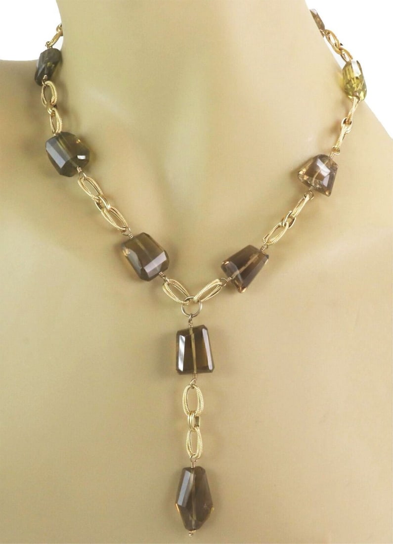 Vintage 14k Yellow Gold Lariat Necklace with Smoky and Green Quartz: Vintage 14k Yellow Gold Lariat Necklace with Smoky and Green Quartz This vintage lariat necklace is crafted from solid 14k yellow gold and showcases textured oval links adorned with organically shaped