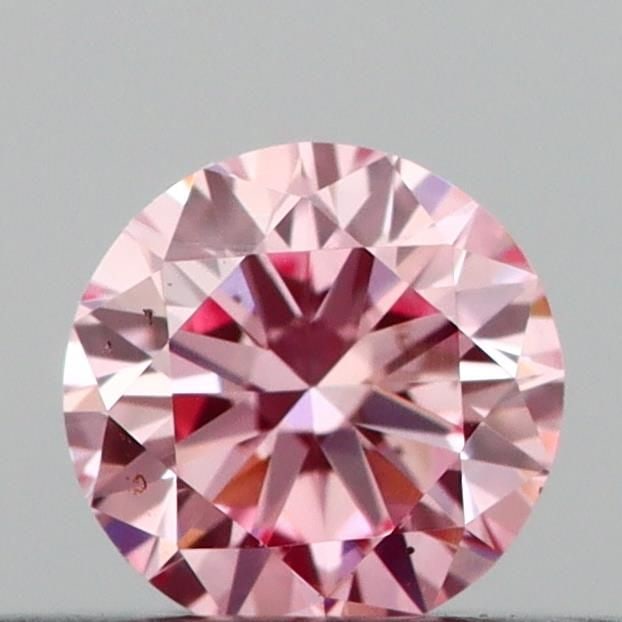 Loose Diamond - ROUND 0.2ct Fancy Vivid Pink VS1: Loose Diamond - ROUND 0.2ct Fancy Vivid Pink VS1 Source: This is a real non-mined Diamond that has been grown in a lab Shape: ROUND Carats: 0.2 Color: Fancy Vivid Pink Certification: IGI Video:
