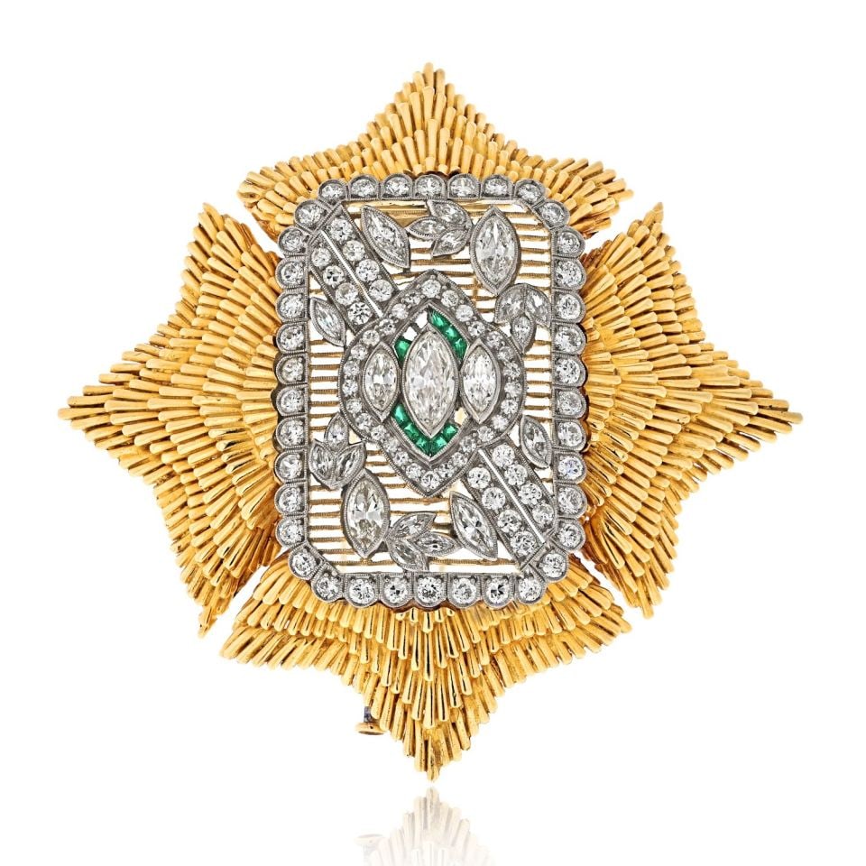 Platinum and 18K Gold Maltese Brooch with Diamonds and Emeralds by David Webb: Platinum and 18K Gold Maltese Brooch with Diamonds and Emeralds by David Webb This David Webb brooch features a striking Maltese cross design crafted in platinum and 18K yellow gold. The piece is set 