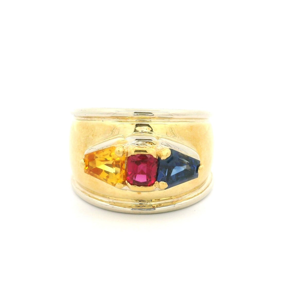 18k Yellow Gold 2.33ct Ruby Yellow Blue Sapphire Wide Band Ring: 18k Yellow Gold 2.33ct Ruby Yellow Blue Sapphire Wide Band Ring This stunning 18k yellow gold band ring features a striking combination of natural gemstones, making it a perfect statement piece. The r