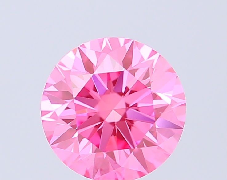 Ideal Loose Diamond - ROUND 0.7ct Fancy Vivid Pink VVS2: Ideal Loose Diamond - ROUND 0.7ct Fancy Vivid Pink VVS2 Source: This is a real non-mined Diamond that has been grown in a lab Shape: ROUND Carats: 0.7 Color: Fancy Vivid Pink Certification: IGI Video: