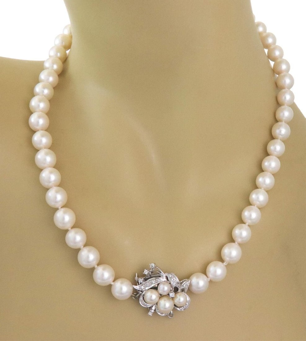 Vintage Pearl Strand Necklace 14k White Gold Diamond Floral Clasp: Vintage Pearl Strand Necklace 14k White Gold Diamond Floral Clasp This vintage estate necklace features a single strand of luminous, creamy pearls, each measuring approximately 8.8mm and displaying be