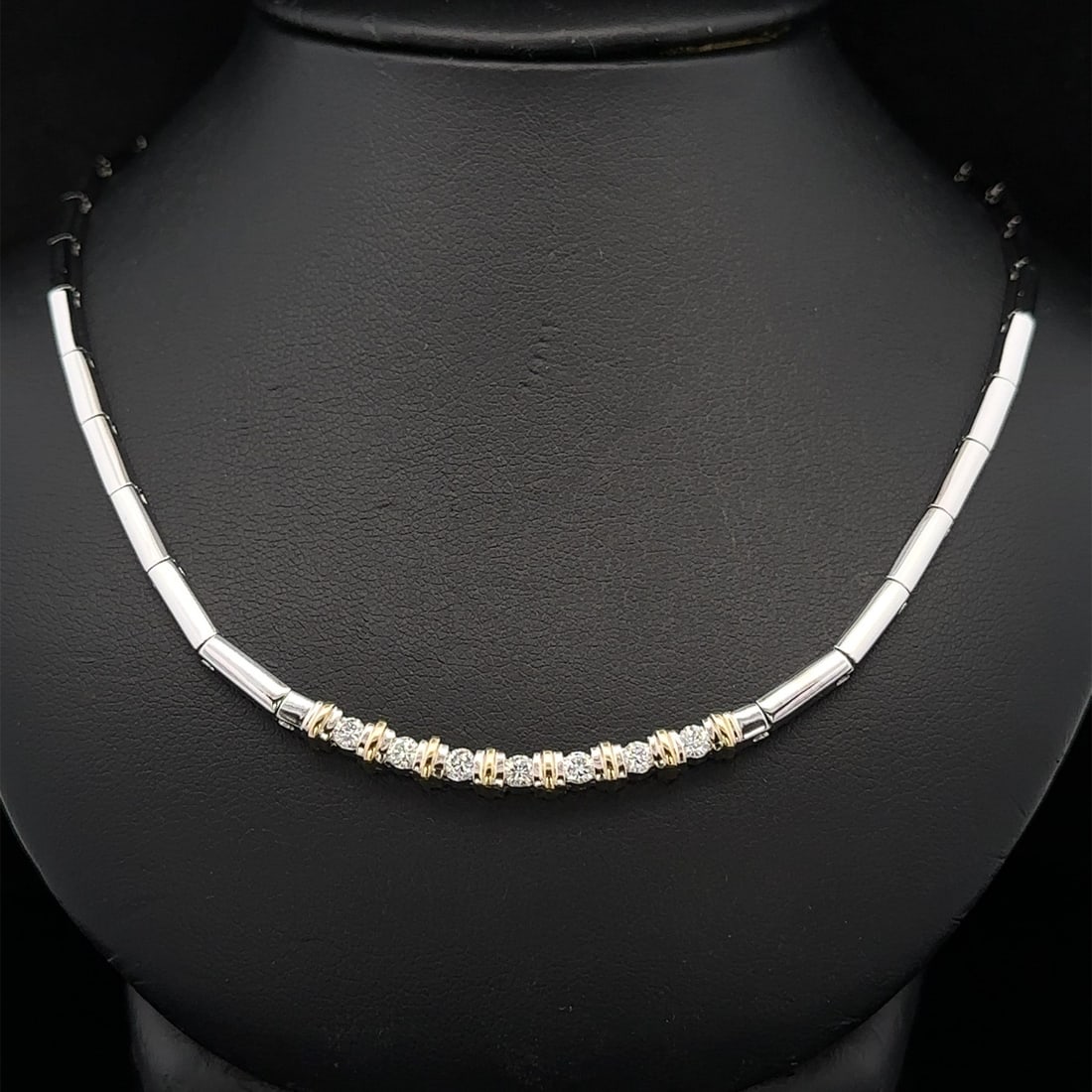 Channel Set 18k White Gold Necklace with 0.56ctw Seven Diamonds 18 Inch: Channel Set 18k White Gold Necklace with 0.56ctw Seven Diamonds 18 Inch This articulated bar link necklace features seven natural round brilliant cut diamonds with a total carat weight of approximatel