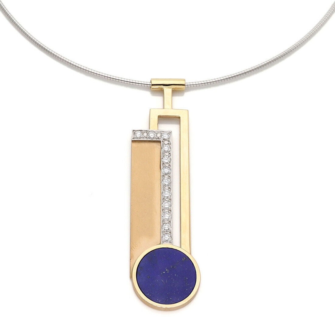 Lariat Necklace 18k Two Tone Gold Lapis Diamond Pendant: Lariat Necklace 18k Two Tone Gold Lapis Diamond Pendant This elegant lariat necklace features a striking elongated pendant crafted from 18k yellow and white gold. The pendant is adorned with deep blue
