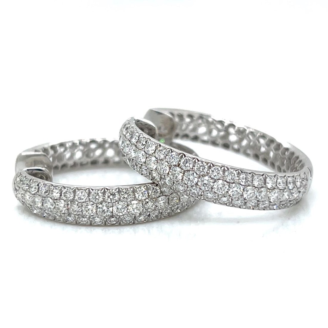 Diamond Hoop Earrings in 18K White Gold with 4.00 Carats: Diamond Hoop Earrings in 18K White Gold with 4.00 Carats These hoop earrings are crafted from 18K white gold and feature a total of 114 diamonds with an approximate combined weight of 4.00 carats. The