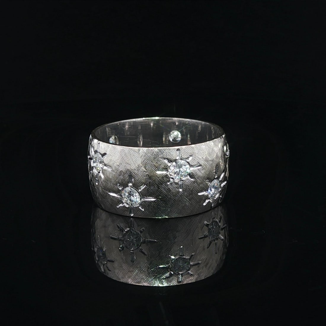 White Gold 0.60ctw Star Pave Diamond Wide Eternity Band Ring: White Gold 0.60ctw Star Pave Diamond Wide Eternity Band Ring This exquisite White Gold Eternity Band Ring features a stunning design enhanced by .60ctw of hand-set round brilliant cut diamonds in a st