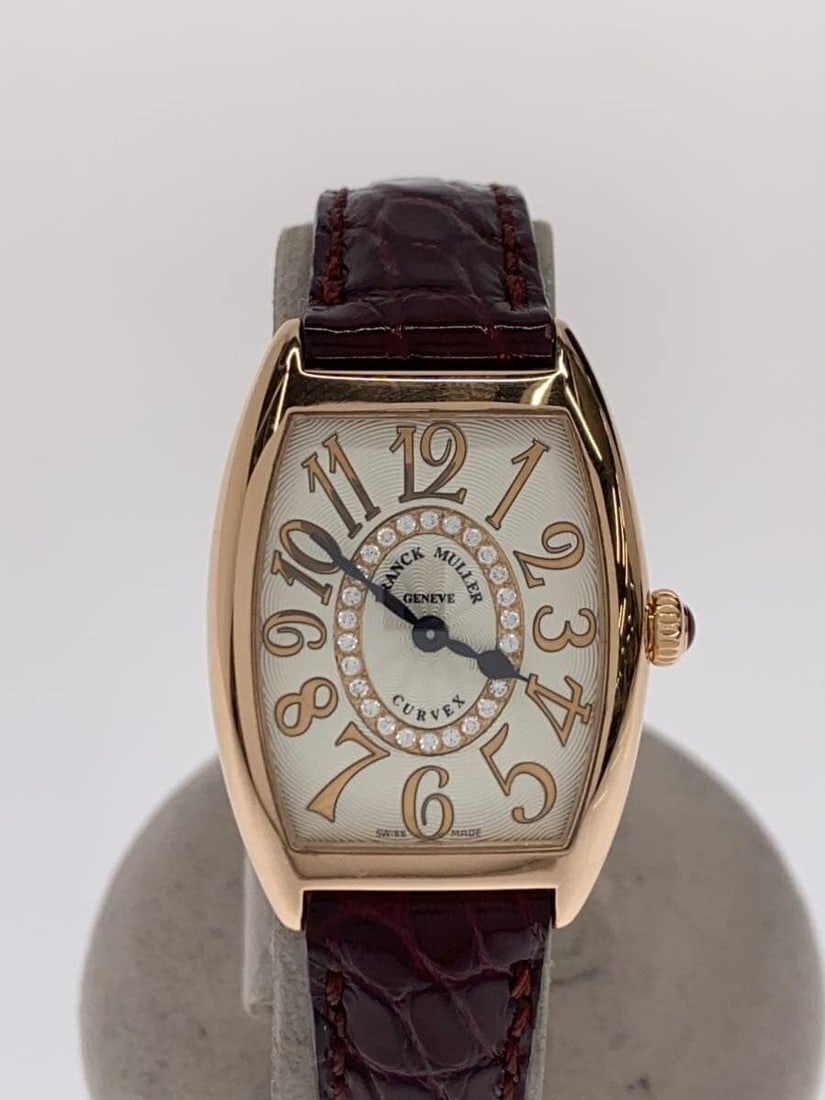 Franck Muller Tonneau Curvex white leather women's wristwatch: Franck Muller Tonneau Curvex white leather women's wristwatch This Franck Muller Tonneau Curvex wristwatch is designed for women and features a white dial and a leather strap. Made in Switzerland, the