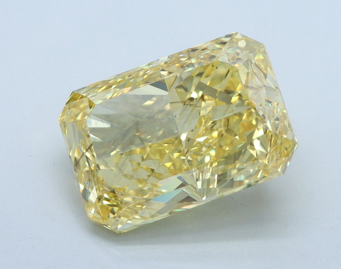 Loose Diamond - RADIANT 5.26ct Fancy Vivid Yellow SI1: Loose Diamond - RADIANT 5.26ct Fancy Vivid Yellow SI1 Source: This is a real non-mined Diamond that has been grown in a lab Shape: RADIANT Carats: 5.26 Color: Fancy Vivid Yellow Certification: IGI Vid