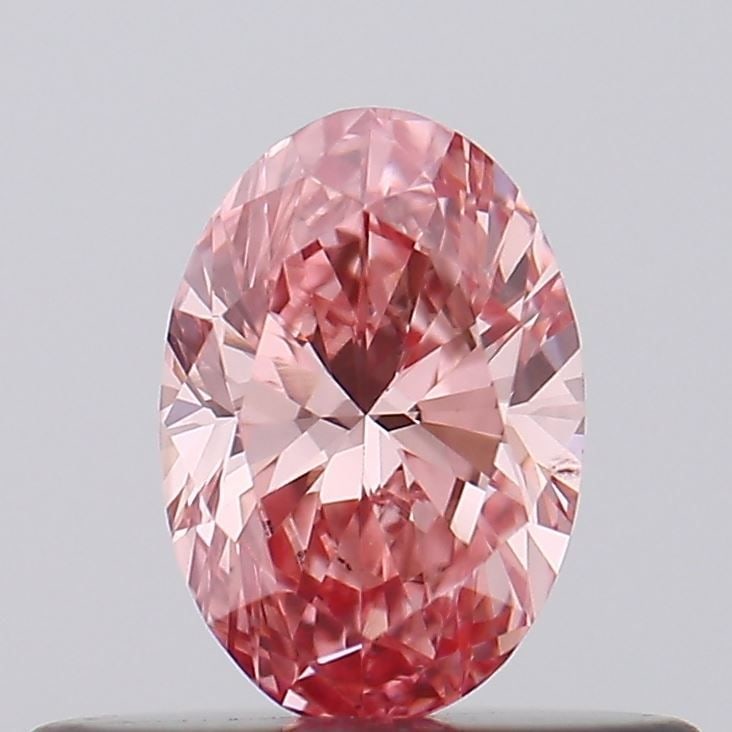Loose Diamond - OVAL 0.31ct Fancy Vivid Pink VS2: Loose Diamond - OVAL 0.31ct Fancy Vivid Pink VS2 Source: This is a real non-mined Diamond that has been grown in a lab Shape: OVAL Carats: 0.31 Color: Fancy Vivid Pink Certification: IGI Video: