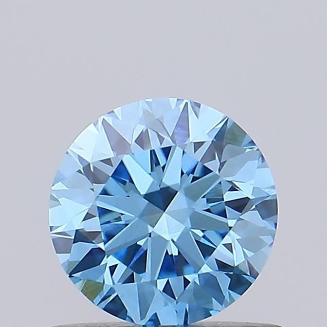 Loose Diamond - ROUND 0.69ct Fancy Vivid Blue VVS2: Loose Diamond - ROUND 0.69ct Fancy Vivid Blue VVS2 Source: This is a real non-mined Diamond that has been grown in a lab Shape: ROUND Carats: 0.69 Color: Fancy Vivid Blue Certification: IGI Video:
