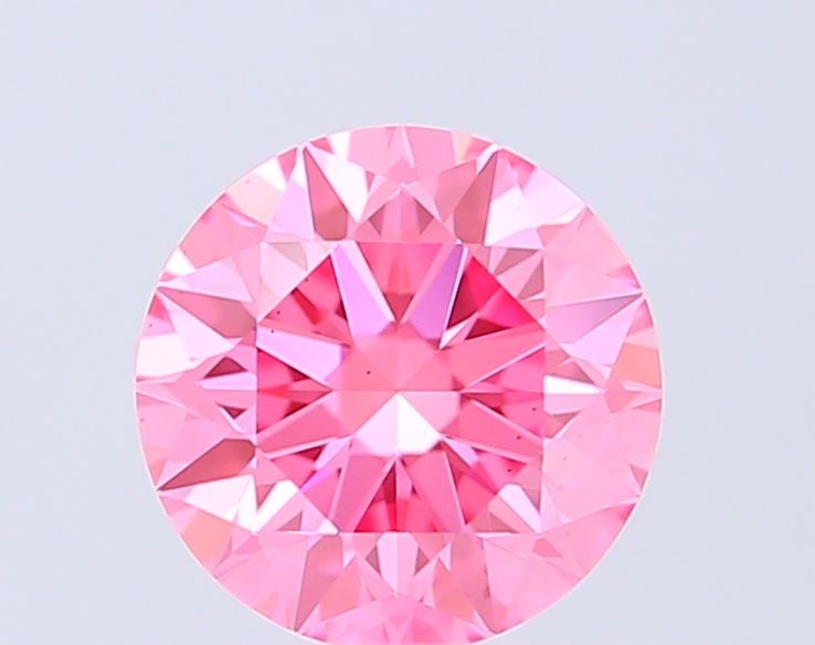 Ideal Loose Diamond - ROUND 0.72ct Fancy Vivid Pink VS1: Ideal Loose Diamond - ROUND 0.72ct Fancy Vivid Pink VS1 Source: This is a real non-mined Diamond that has been grown in a lab Shape: ROUND Carats: 0.72 Color: Fancy Vivid Pink Certification: IGI Video