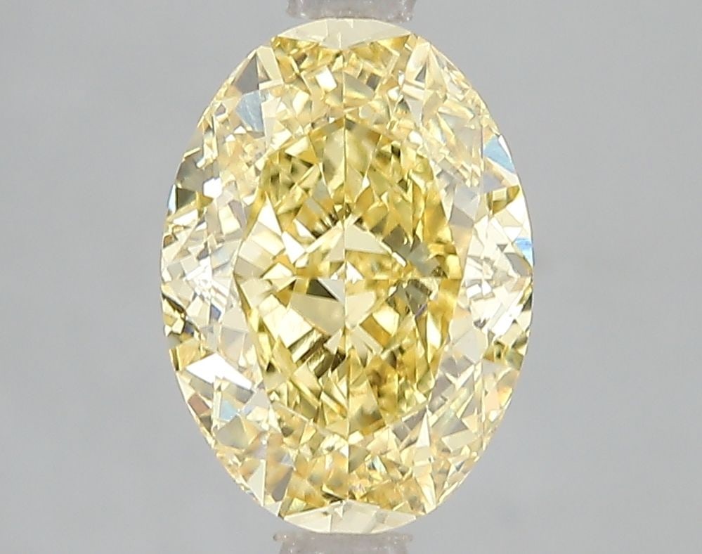 Loose Diamond - OVAL 3.01ct Fancy Vivid Yellow VS1: Loose Diamond - OVAL 3.01ct Fancy Vivid Yellow VS1 Source: This is a real non-mined Diamond that has been grown in a lab Shape: OVAL Carats: 3.01 Color: Fancy Vivid Yellow Certification: IGI Video:
