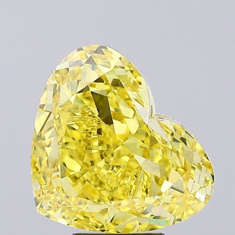 Loose Diamond - HEART 7.03ct Fancy Vivid Yellow VS1: Loose Diamond - HEART 7.03ct Fancy Vivid Yellow VS1 Source: This is a real non-mined Diamond that has been grown in a lab Shape: HEART Carats: 7.03 Color: Fancy Vivid Yellow Certification: IGI Video: