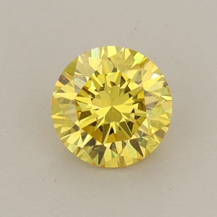 Loose Diamond - ROUND 0.6ct Fancy Vivid Yellow VS2: Loose Diamond - ROUND 0.6ct Fancy Vivid Yellow VS2 Source: This is a real non-mined Diamond that has been grown in a lab Shape: ROUND Carats: 0.6 Color: Fancy Vivid Yellow Certification: IGI Video: