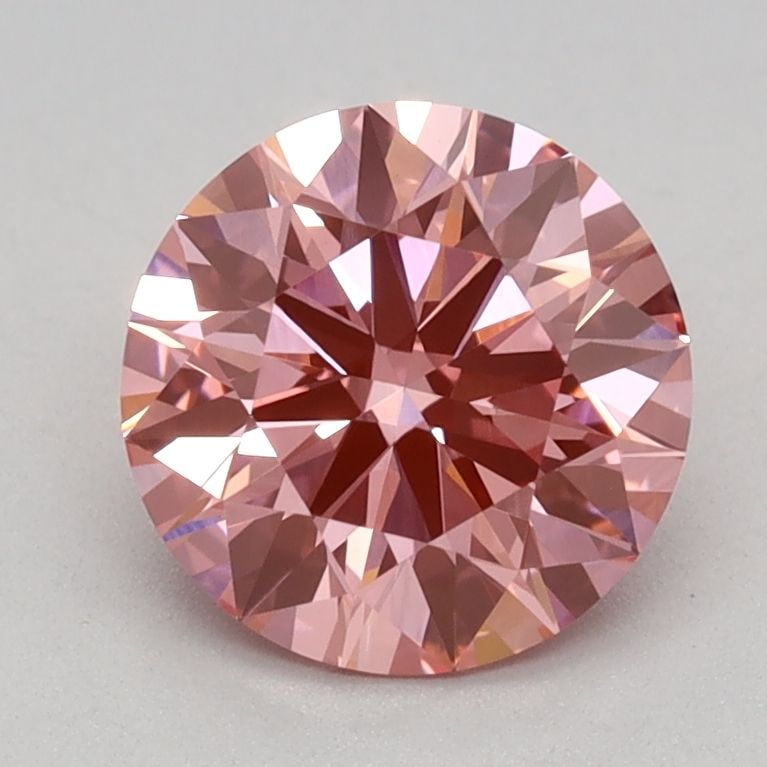 Ideal Loose Diamond - ROUND 1.15ct Fancy Vivid Pink VVS2: Ideal Loose Diamond - ROUND 1.15ct Fancy Vivid Pink VVS2 Source: This is a real non-mined Diamond that has been grown in a lab Shape: ROUND Carats: 1.15 Color: Fancy Vivid Pink Certification: IGI Vide
