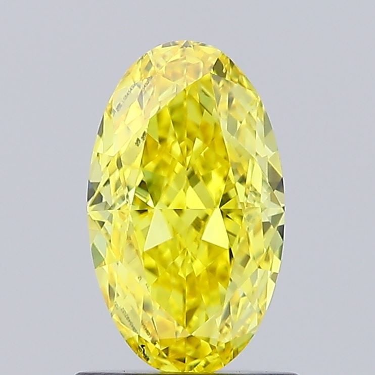 Loose Diamond - OVAL 1.01ct Fancy Vivid Yellow VVS2: Loose Diamond - OVAL 1.01ct Fancy Vivid Yellow VVS2 Source: This is a real non-mined Diamond that has been grown in a lab Shape: OVAL Carats: 1.01 Color: Fancy Vivid Yellow Certification: IGI Video: