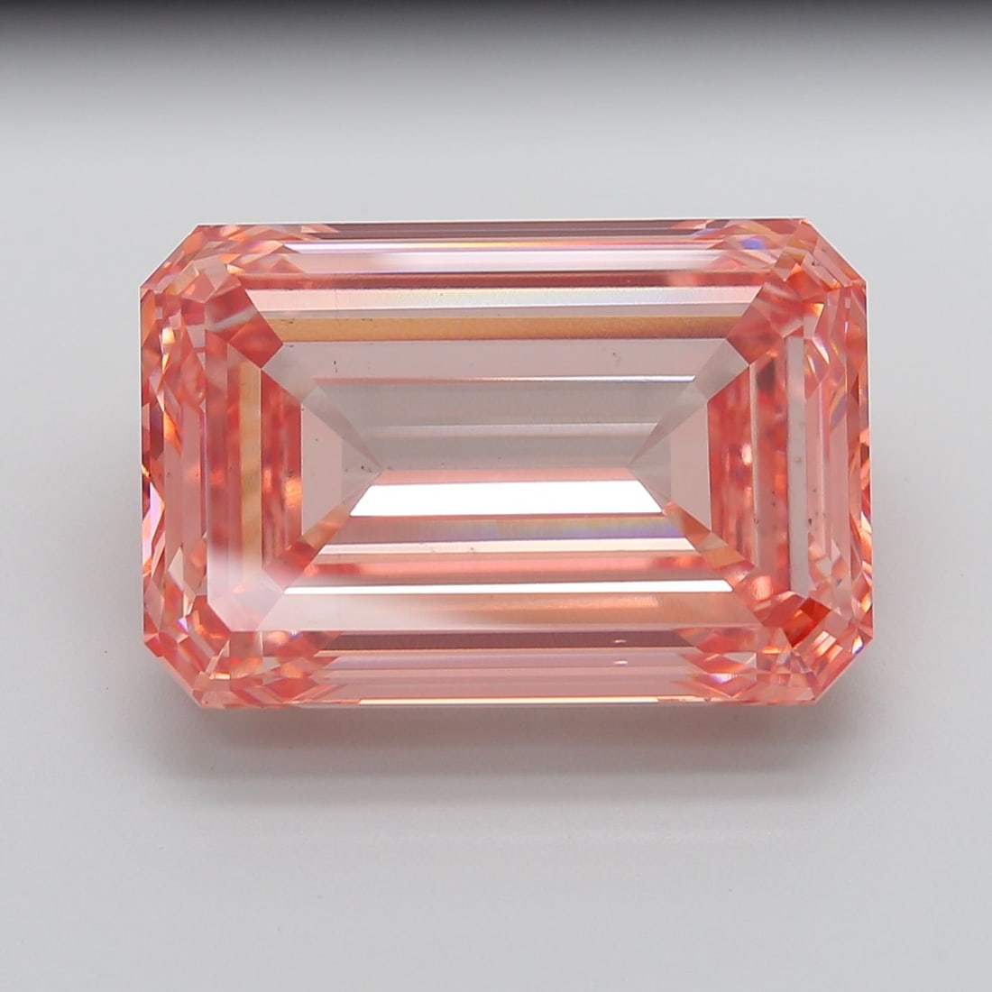 Loose Diamond - EMERALD 35.08ct Fancy Vivid Pink VS2: Loose Diamond - EMERALD 35.08ct Fancy Vivid Pink VS2 Source: This is a real non-mined Diamond that has been grown in a lab Shape: EMERALD Carats: 35.08 Color: Fancy Vivid Pink Certification: IGI Video