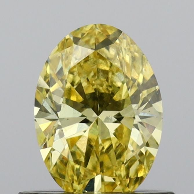 Loose Diamond - OVAL 0.65ct Fancy Vivid Yellow VS2: Loose Diamond - OVAL 0.65ct Fancy Vivid Yellow VS2 Source: This is a real non-mined Diamond that has been grown in a lab Shape: OVAL Carats: 0.65 Color: Fancy Vivid Yellow Certification: IGI Video: