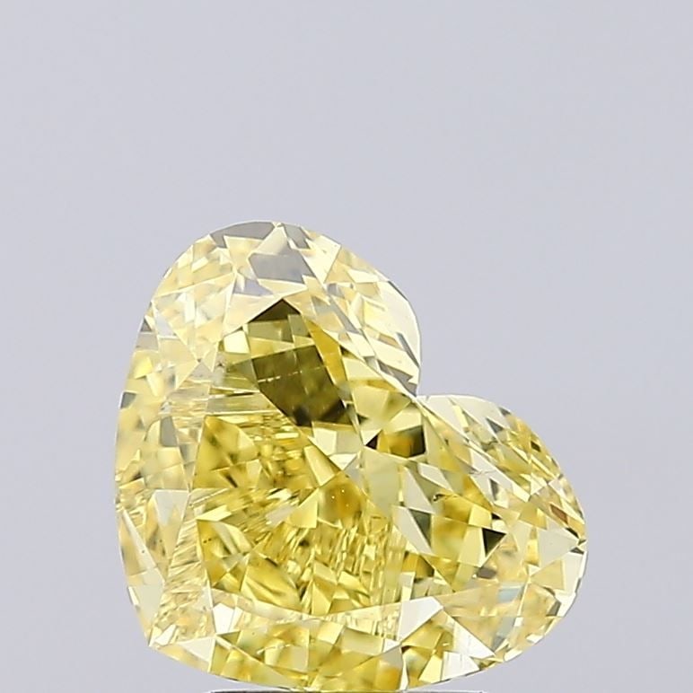 Loose Diamond - HEART 3.03ct Fancy Vivid Yellow VS1: Loose Diamond - HEART 3.03ct Fancy Vivid Yellow VS1 Source: This is a real non-mined Diamond that has been grown in a lab Shape: HEART Carats: 3.03 Color: Fancy Vivid Yellow Certification: IGI Video: