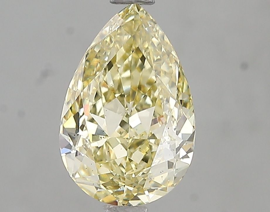 Loose Diamond - PEAR 2.01ct Fancy Yellow SI1: Loose Diamond - PEAR 2.01ct Fancy Yellow SI1 Source: This is a real non-mined Diamond that has been grown in a lab Shape: PEAR Carats: 2.01 Color: Fancy Yellow Certification: IGI Video: