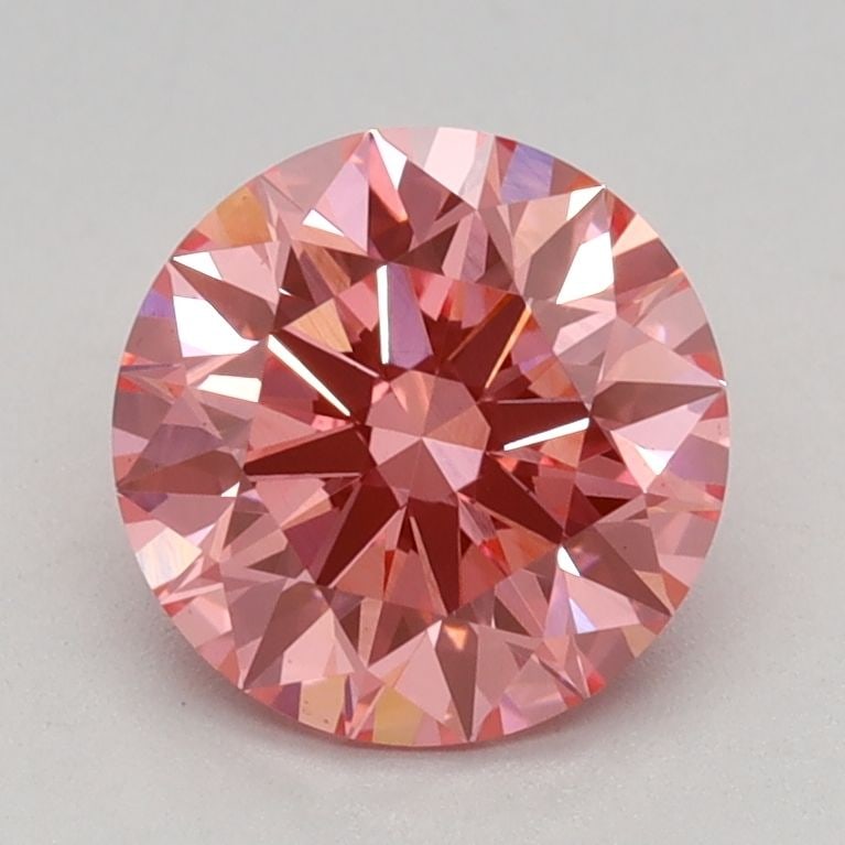 Ideal Loose Diamond - ROUND 1.11ct Fancy Vivid Pink VS1: Ideal Loose Diamond - ROUND 1.11ct Fancy Vivid Pink VS1 Source: This is a real non-mined Diamond that has been grown in a lab Shape: ROUND Carats: 1.11 Color: Fancy Vivid Pink Certification: IGI Video
