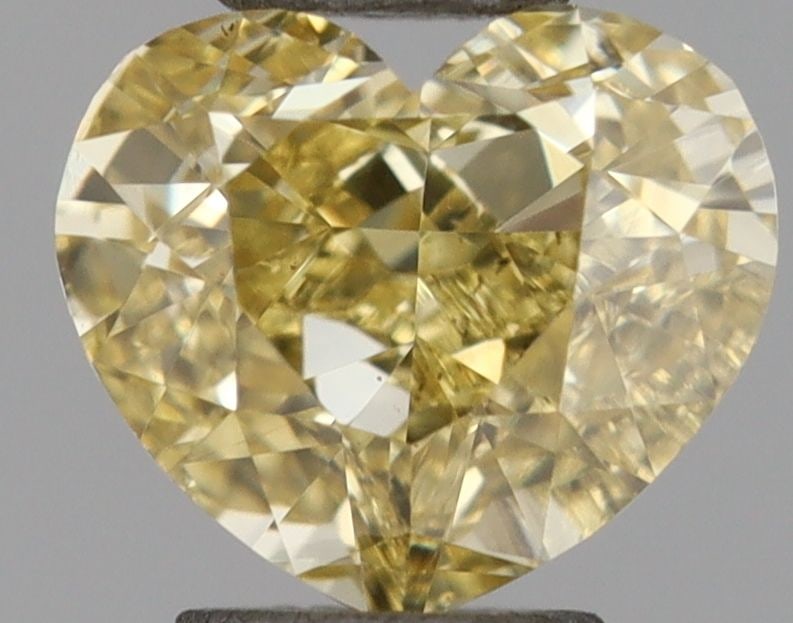 Loose Diamond - HEART 0.54ct Fancy Vivid Yellow VS1: Loose Diamond - HEART 0.54ct Fancy Vivid Yellow VS1 Source: This is a real non-mined Diamond that has been grown in a lab Shape: HEART Carats: 0.54 Color: Fancy Vivid Yellow Certification: NONE Video: