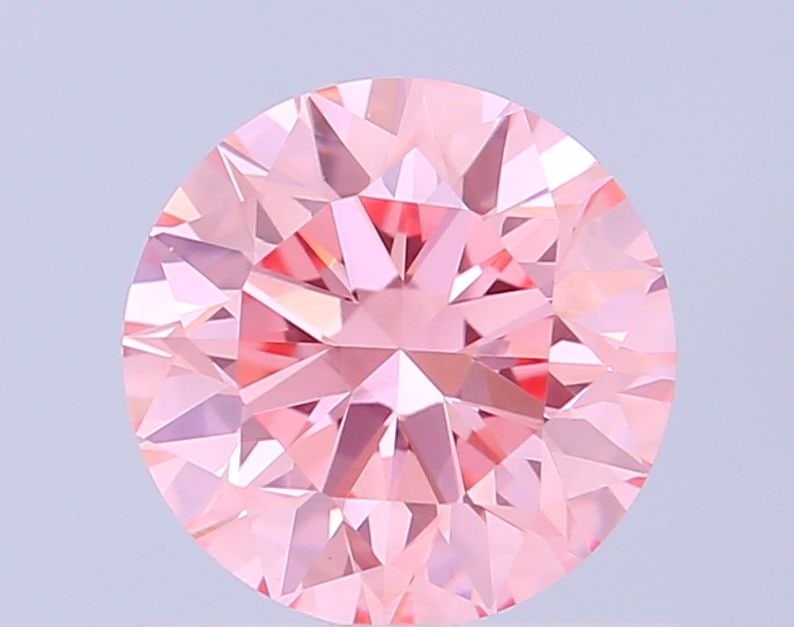 Loose Diamond - ROUND 0.86ct Fancy Vivid Pink VVS2: Loose Diamond - ROUND 0.86ct Fancy Vivid Pink VVS2 Source: This is a real non-mined Diamond that has been grown in a lab Shape: ROUND Carats: 0.86 Color: Fancy Vivid Pink Certification: IGI Video: