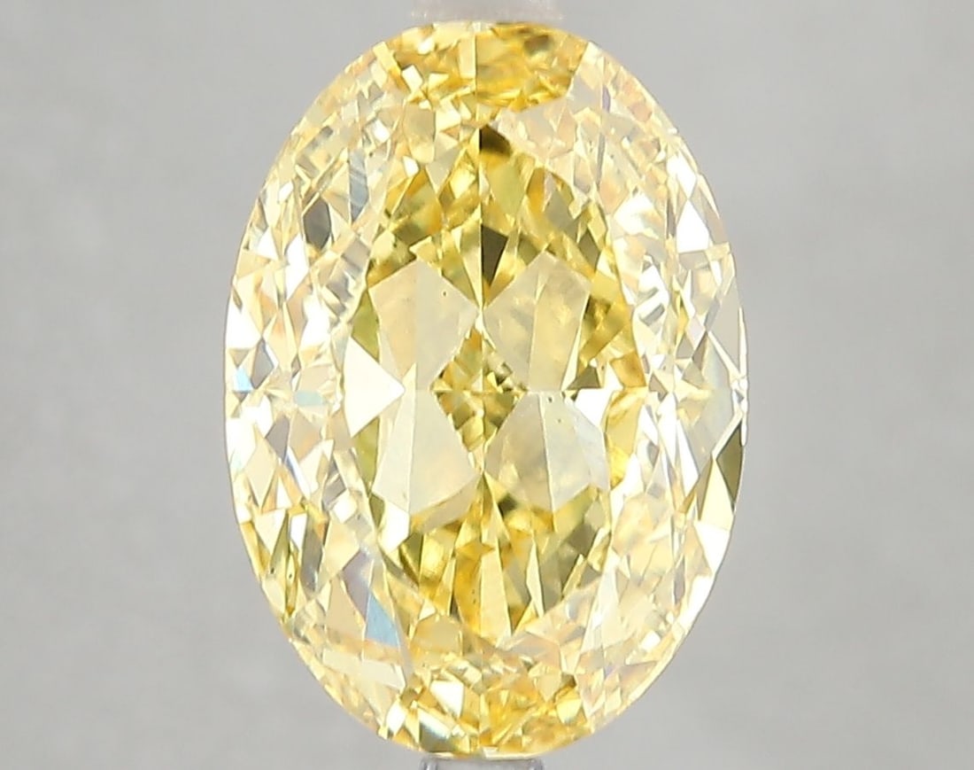 Loose Diamond - OVAL 5.01ct Fancy Vivid Yellow VS2: Loose Diamond - OVAL 5.01ct Fancy Vivid Yellow VS2 Source: This is a real non-mined Diamond that has been grown in a lab Shape: OVAL Carats: 5.01 Color: Fancy Vivid Yellow Certification: IGI Video: