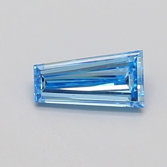 Loose Diamond - TAPERED BAGUETTE 0.58ct Fancy Vivid Blue VS1: Loose Diamond - TAPERED BAGUETTE 0.58ct Fancy Vivid Blue VS1 Source: This is a real non-mined Diamond that has been grown in a lab Shape: TAPERED BAGUETTE Carats: 0.58 Color: Fancy Vivid Blue Certific