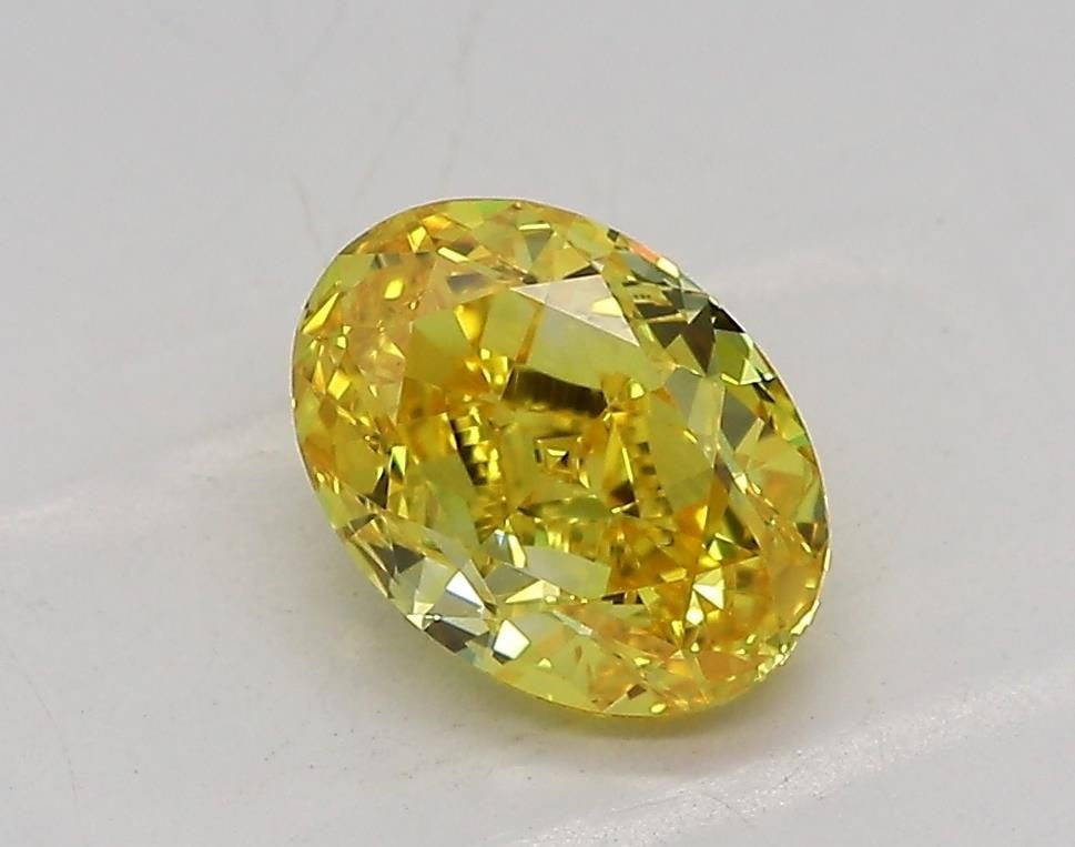 Loose Diamond - OVAL 1.06ct Fancy Vivid Yellow VVS1: Loose Diamond - OVAL 1.06ct Fancy Vivid Yellow VVS1 Source: This is a real non-mined Diamond that has been grown in a lab Shape: OVAL Carats: 1.06 Color: Fancy Vivid Yellow Certification: IGI Video: