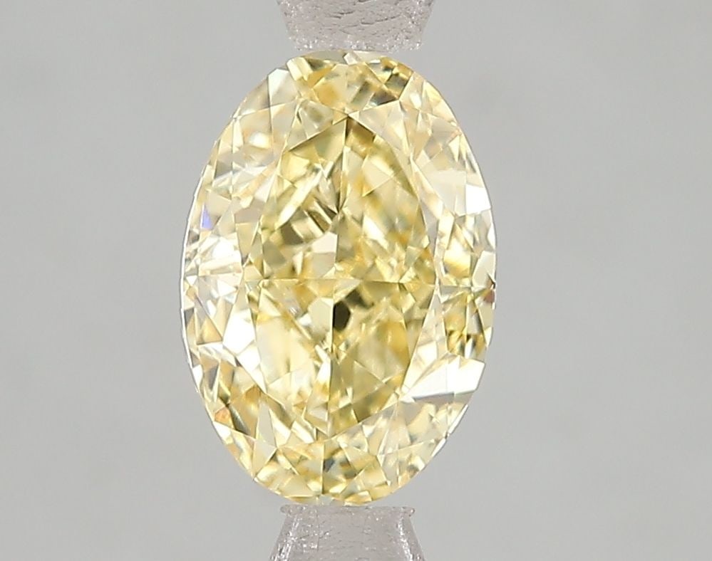 Loose Diamond - OVAL 2.01ct Fancy Intense Yellow VVS2: Loose Diamond - OVAL 2.01ct Fancy Intense Yellow VVS2 Source: This is a real non-mined Diamond that has been grown in a lab Shape: OVAL Carats: 2.01 Color: Fancy Intense Yellow Certification: IGI Vide