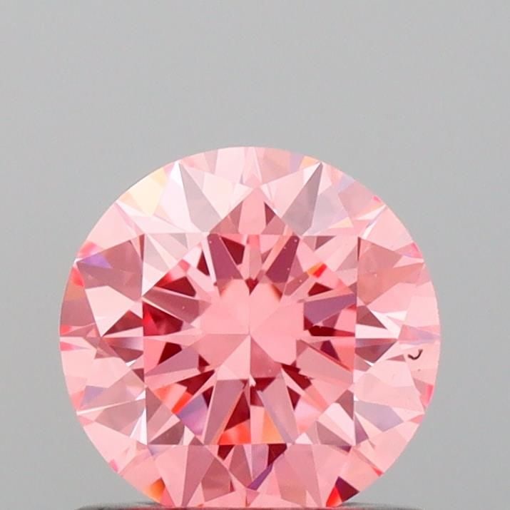 Ideal Loose Diamond - ROUND 0.7ct Fancy Vivid Pink VVS2: Ideal Loose Diamond - ROUND 0.7ct Fancy Vivid Pink VVS2 Source: This is a real non-mined Diamond that has been grown in a lab Shape: ROUND Carats: 0.7 Color: Fancy Vivid Pink Certification: IGI Video: