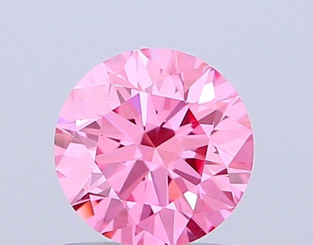Ideal Loose Diamond - ROUND 1.01ct Fancy Vivid Pink VS1: Ideal Loose Diamond - ROUND 1.01ct Fancy Vivid Pink VS1 Source: This is a real non-mined Diamond that has been grown in a lab Shape: ROUND Carats: 1.01 Color: Fancy Vivid Pink Certification: IGI Video