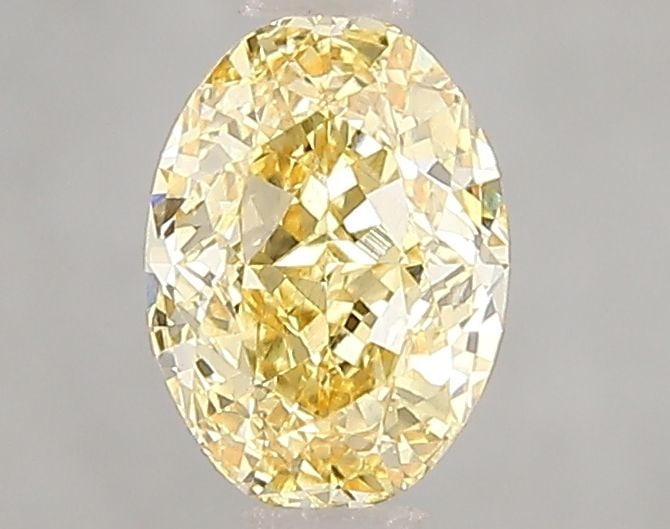Loose Diamond - OVAL 1.03ct Fancy Vivid Yellow VS2: Loose Diamond - OVAL 1.03ct Fancy Vivid Yellow VS2 Source: This is a real non-mined Diamond that has been grown in a lab Shape: OVAL Carats: 1.03 Color: Fancy Vivid Yellow Certification: IGI Video: