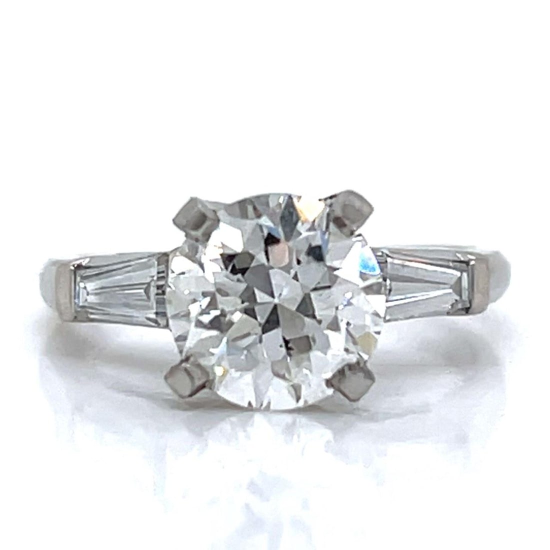 Platinum 1.95 Ct GIA Certified European-cut Diamond Ring with Baguettes: Platinum 1.95 Ct GIA Certified European-cut Diamond Ring with Baguettes This exquisite platinum ring features a stunning GIA certified 1.95 Ct. European-cut diamond, showcasing a brilliant G color and