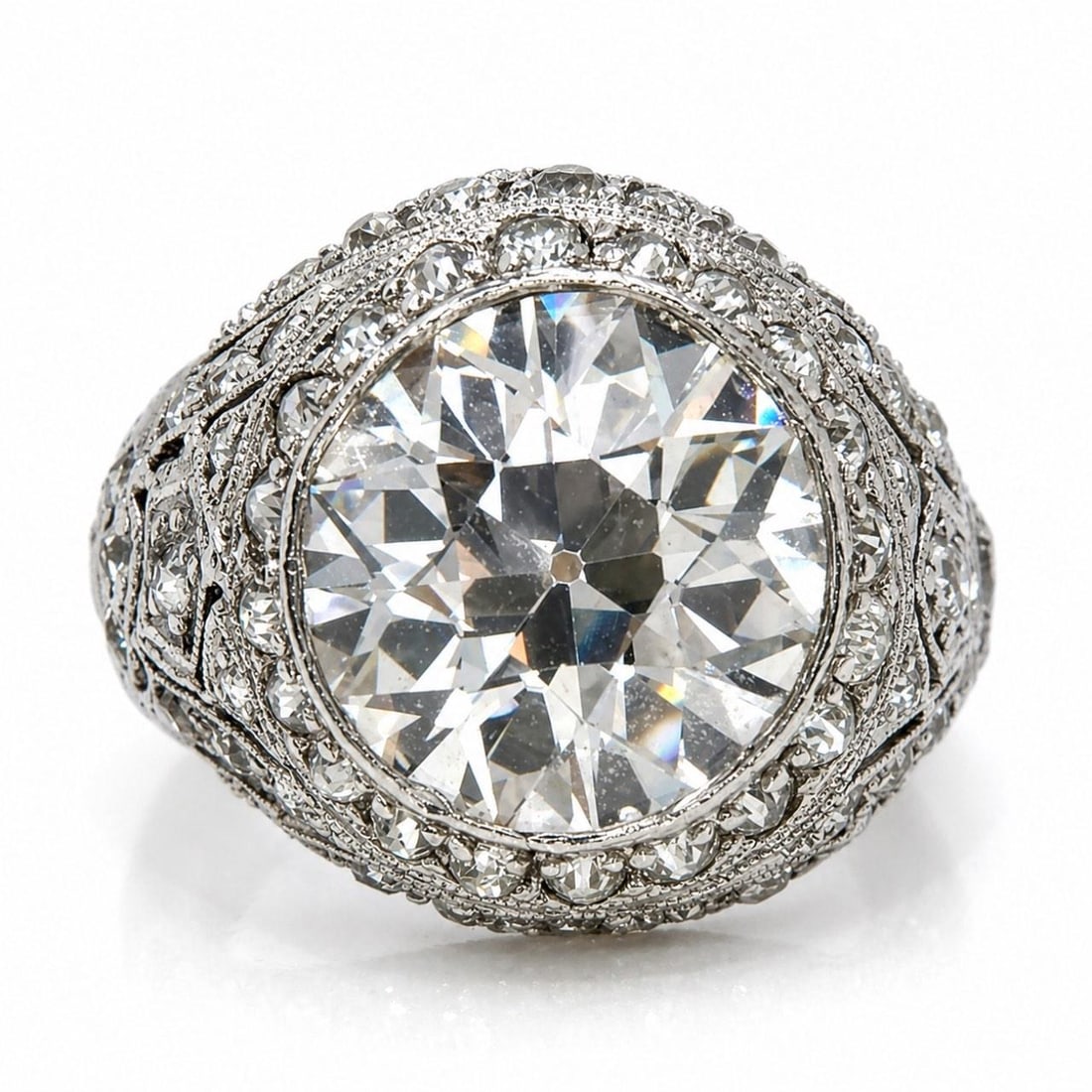 Platinum Art Deco Diamond Ring Featuring 4.75 Ct Center Stone: Platinum Art Deco Diamond Ring Featuring 4.75 Ct Center Stone This Art Deco platinum ring features a central 4.75 carat diamond with I-J color and VS2 clarity. The ring is further accented by approxim