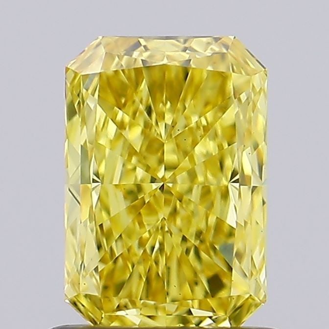 Loose Diamond - RADIANT 0.82ct Fancy Vivid Yellow VS1: Loose Diamond - RADIANT 0.82ct Fancy Vivid Yellow VS1 Source: This is a real non-mined Diamond that has been grown in a lab Shape: RADIANT Carats: 0.82 Color: Fancy Vivid Yellow Certification: IGI Vid