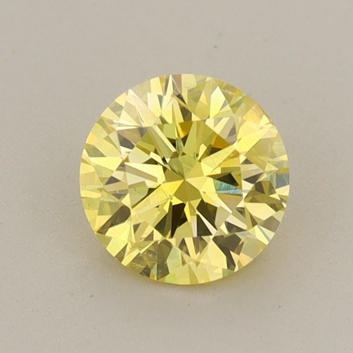 Loose Diamond - ROUND 0.72ct Fancy Vivid Yellow VS2: Loose Diamond - ROUND 0.72ct Fancy Vivid Yellow VS2 Source: This is a real non-mined Diamond that has been grown in a lab Shape: ROUND Carats: 0.72 Color: Fancy Vivid Yellow Certification: IGI Video: