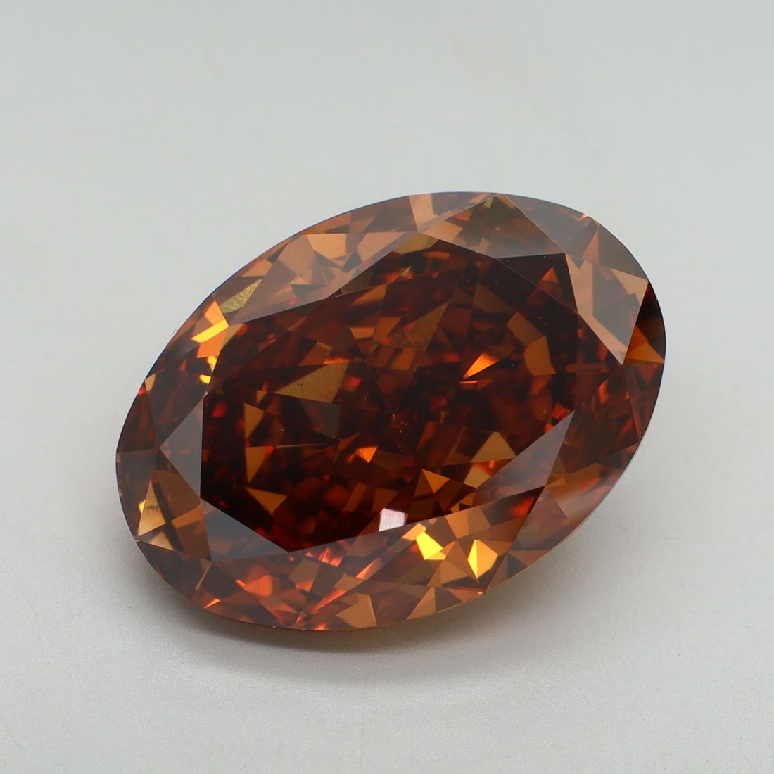 Loose Diamond - OVAL 12.74ct Fancy Vivid Orange VS1: Loose Diamond - OVAL 12.74ct Fancy Vivid Orange VS1 Source: This is a real non-mined Diamond that has been grown in a lab Shape: OVAL Carats: 12.74 Color: Fancy Vivid Orange Certification: IGI Video: