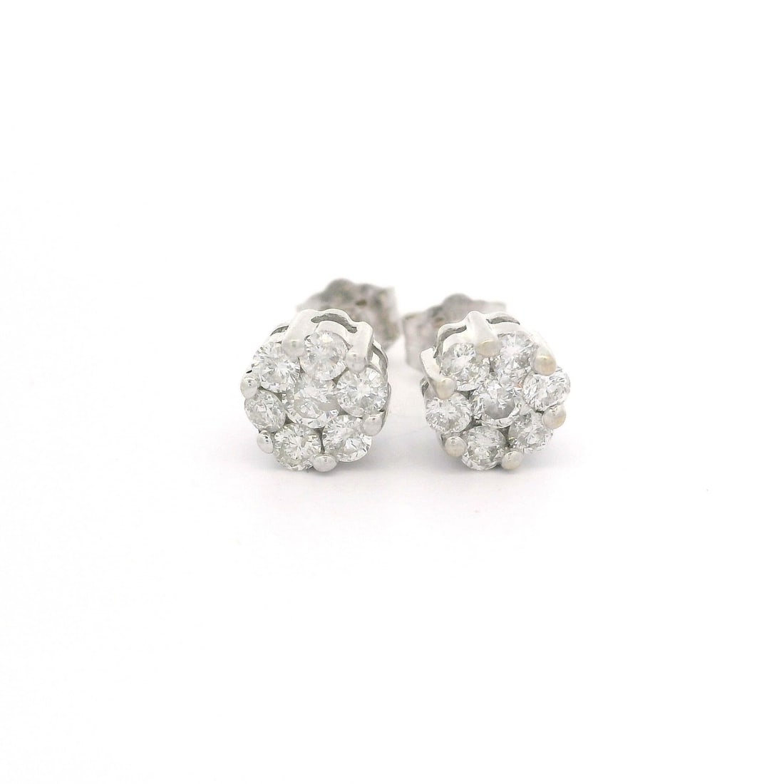 14k White Gold Diamond Cluster Stud Earrings 0.30ctw: 14k White Gold Diamond Cluster Stud Earrings 0.30ctw Elevate your elegance with these stunning 14k White Gold Diamond Cluster Stud Earrings. Featuring a total of 14 natural, round brilliant cut diamon