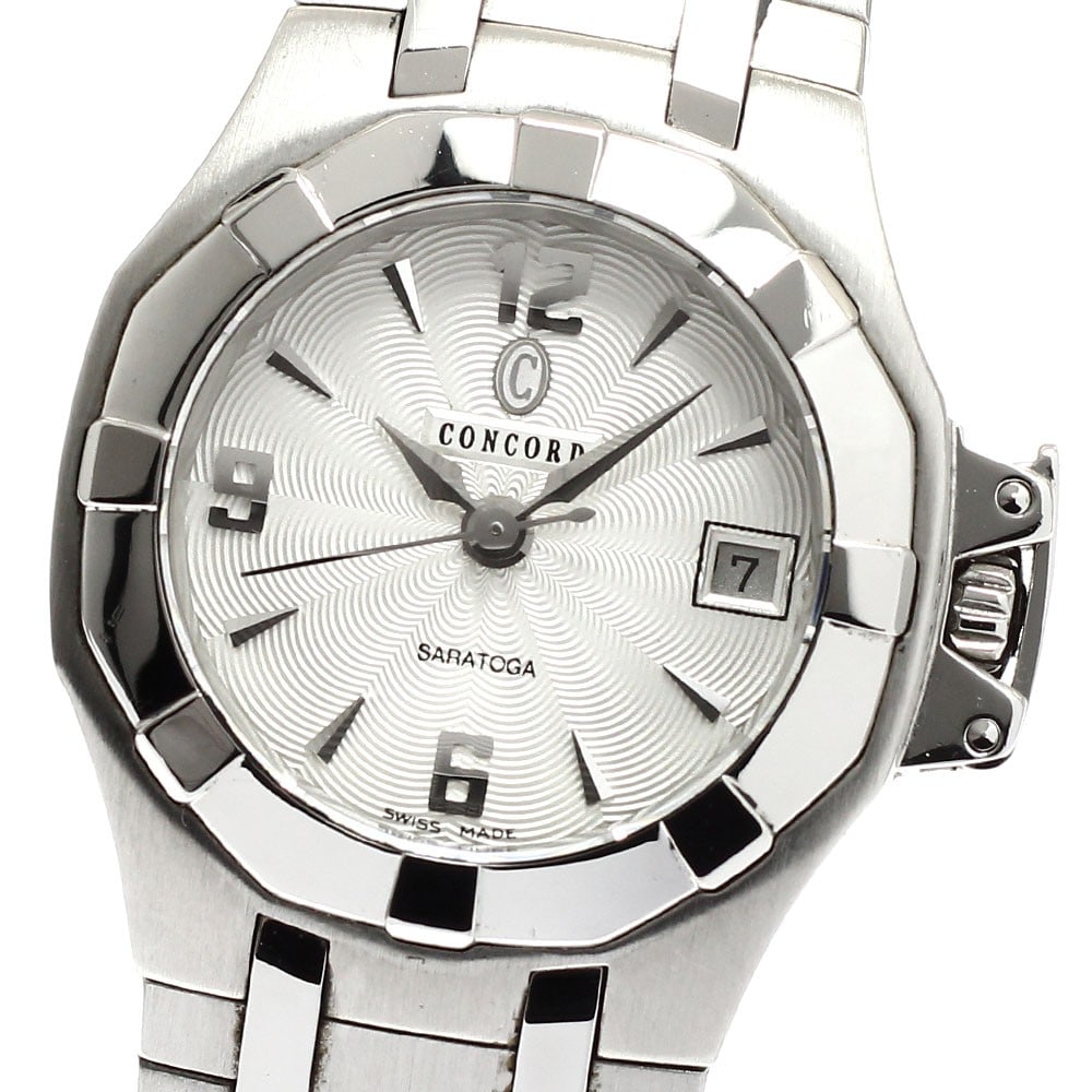 Concord Saratoga quartz date ladies wristwatch: Concord Saratoga quartz date ladies wristwatch This Concord Saratoga women's wristwatch features a stainless steel case and bracelet with a silver dial. The watch is powered by a quartz movement and i
