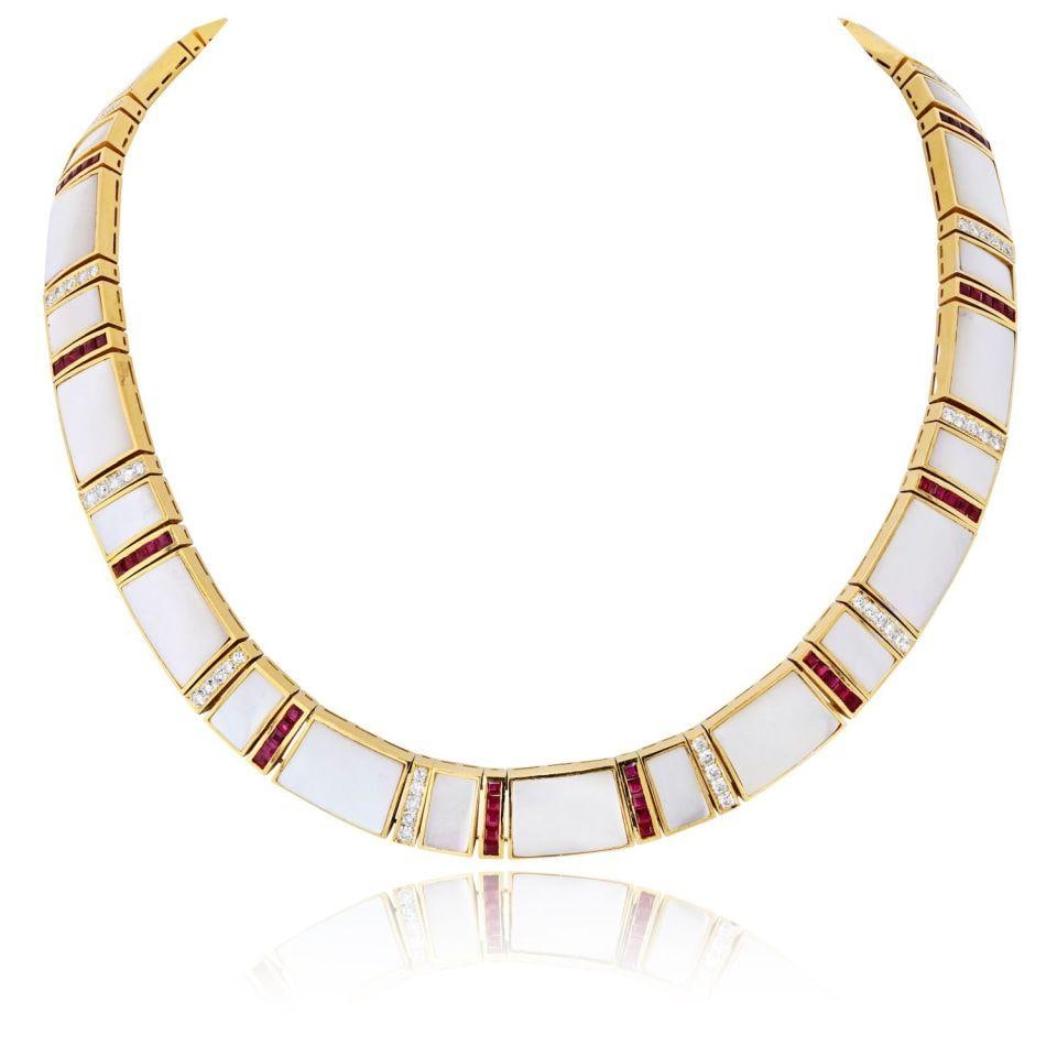 Estate 18K Gold Necklace with Mother of Pearl Ruby Accents and Diamonds: Estate 18K Gold Necklace with Mother of Pearl Ruby Accents and Diamonds This estate necklace is crafted in 18K yellow gold and features a refined linear design adorned with luminous mother-of-pearl pa