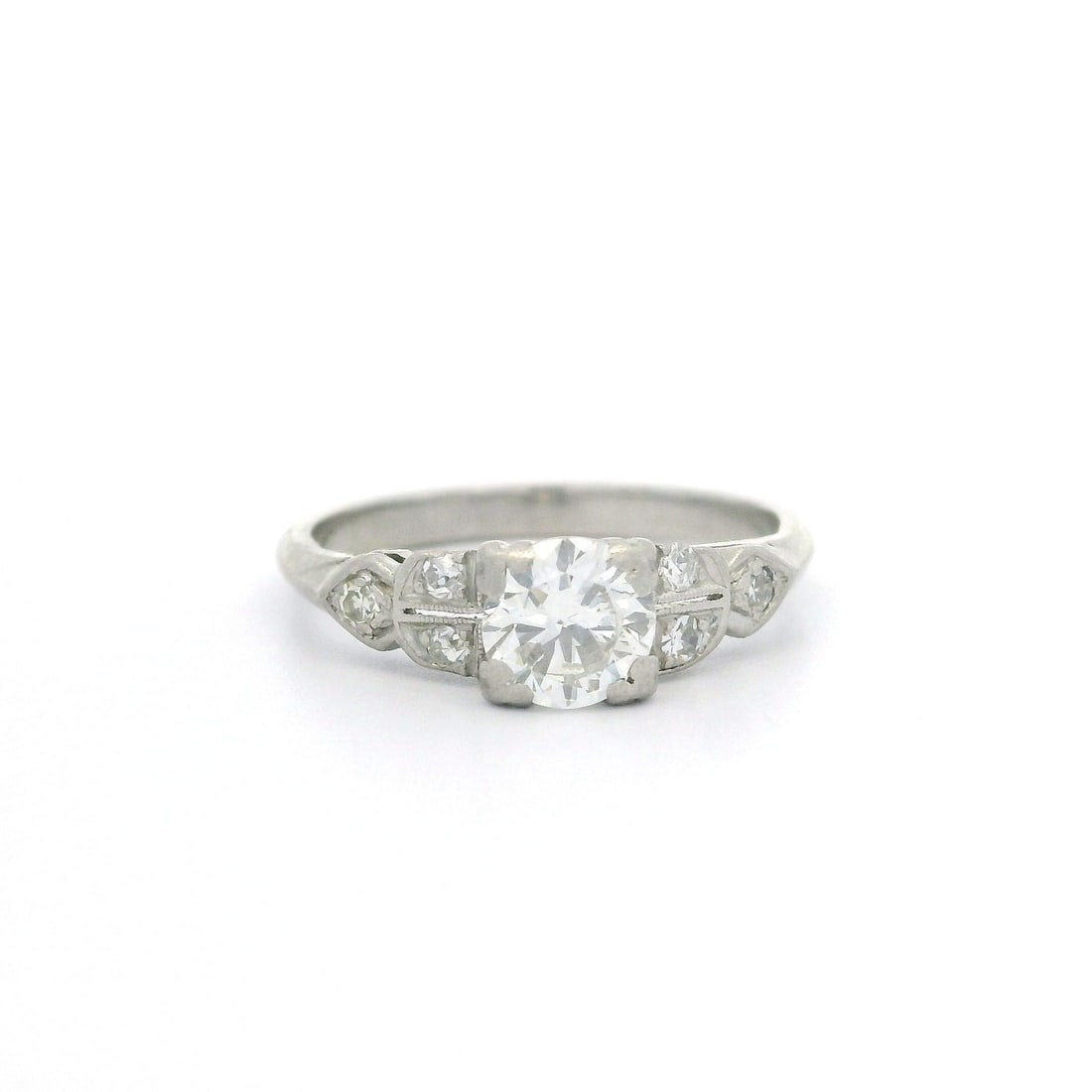 Antique Art Deco Platinum Diamond Ring 0.62ctw VS1 H Color: Antique Art Deco Platinum Diamond Ring 0.62ctw VS1 H Color This exquisite Antique Art Deco ring is crafted from solid platinum, showcasing a stunning array of diamonds. The centerpiece features a natu
