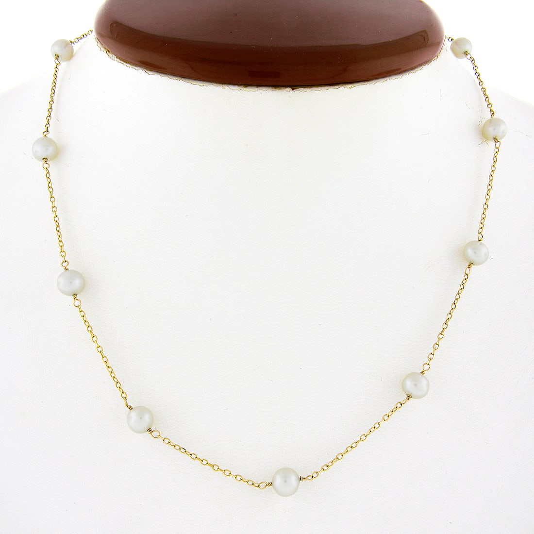 14k Yellow Gold Pearl Station Necklace 16 Inch Cable Chain 11 Cultured Pearls: 14k Yellow Gold Pearl Station Necklace 16 Inch Cable Chain 11 Cultured Pearls This elegant "by the yard" station necklace features 11 round cultured pearls, each approximately 5-6mm in size, evenly sp