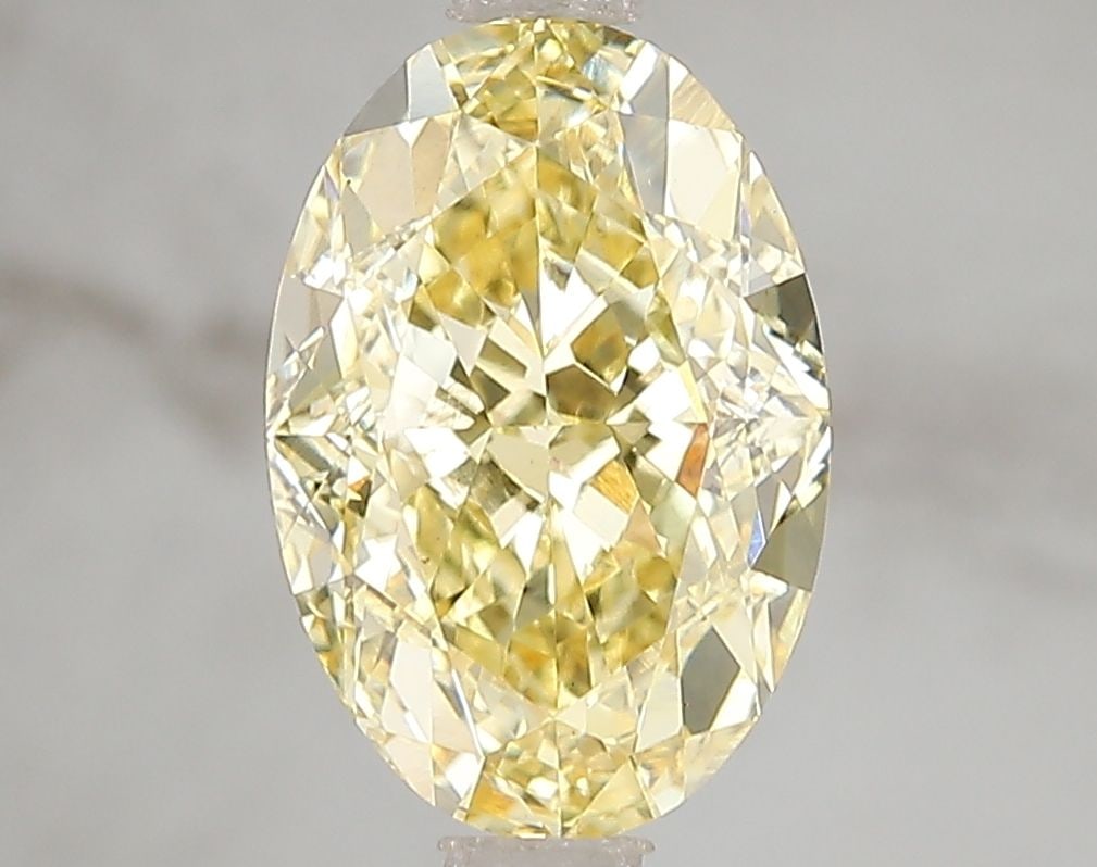 Loose Diamond - OVAL 3.07ct Fancy Vivid Yellow VS1: Loose Diamond - OVAL 3.07ct Fancy Vivid Yellow VS1 Source: This is a real non-mined Diamond that has been grown in a lab Shape: OVAL Carats: 3.07 Color: Fancy Vivid Yellow Certification: IGI Video: